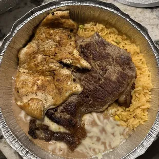 a plate of meat and rice