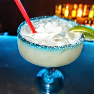 The Coconut Margarita: made with 1800 coconut tequila, fresh lime juice, agave syrup and topped with coconut flakes on top!