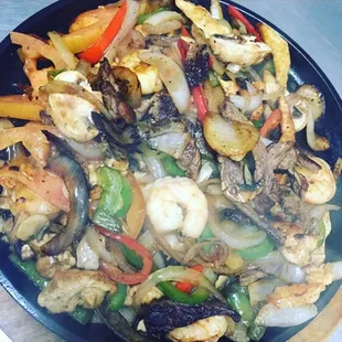 The Fajitas Supremas: another Guadalajara's favorite. Made with steak, chicken, shrimp and tossed with veggies on a hot iron skillet!
