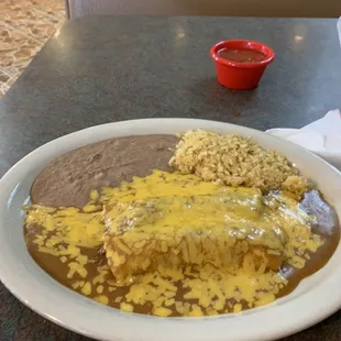 My yummy beef enchilada, dinner with rice and beans and gobs of cheddar cheese!!