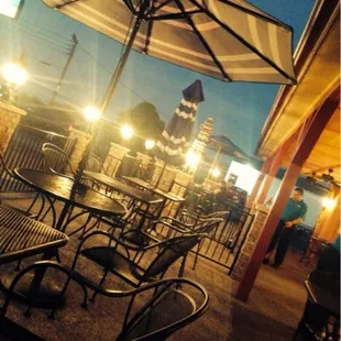 tables and umbrellas at night