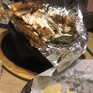 a plate of food with tortillas and tortillas