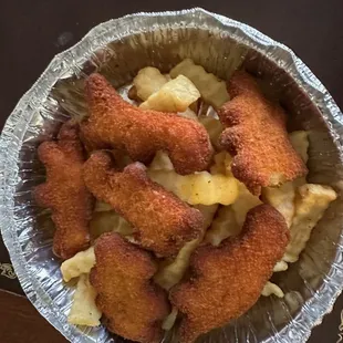 Inedible, burnt chicken nuggets and undercooked fries.