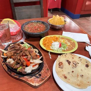 Beef Fajitas Combo, table-made salsa and fresh flour tortillas.
