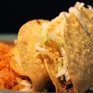 a taco and rice on a plate