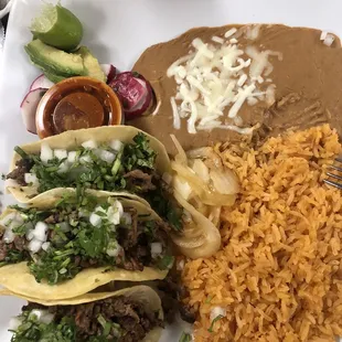 a plate of mexican food with rice and beans
