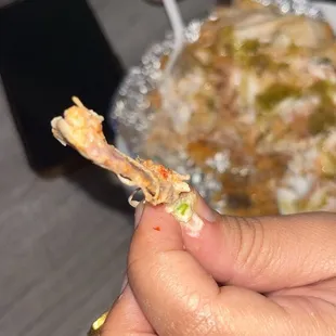 a person eating a piece of pizza