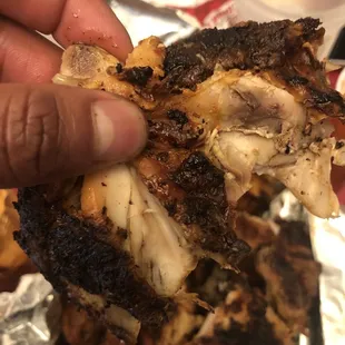 a hand holding a piece of food