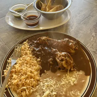 Chicken with mole sauce beans and rice