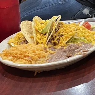 4-12-2022. #21 Three crispy tacos rice and beans.