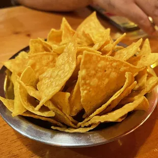 a bowl of nachos on a table