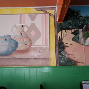 a painting of two vases on a wall