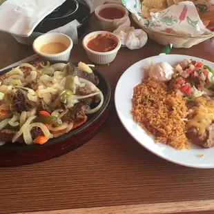 two plates of mexican food on a table