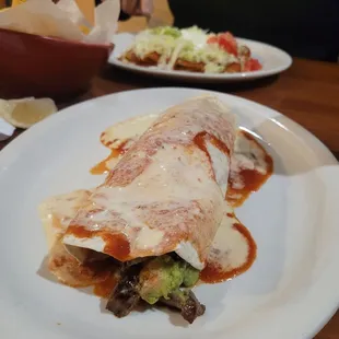 California Burrito with Steak, Mexican Enchiladas in the back.