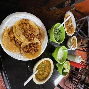 a table with a variety of tacoss