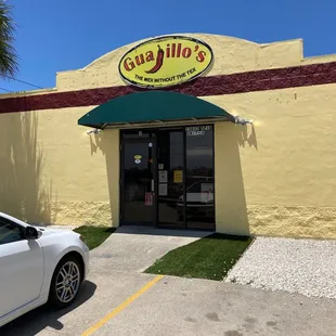 a car parked in front of a restaurant