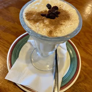 Arroz Con Leche topped with cinnamon and raisins