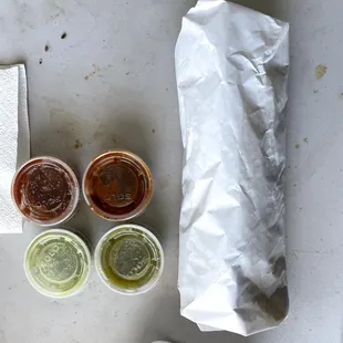 Overhead of the breakfast burrito and one of each salsa
