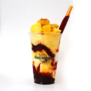 Mangonada: Mango sorbet with homemade chamoy, Tajín, and fresh mango. A perfect mix of sweet, tangy, and spicy flavors!