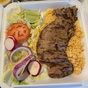 Carne Asada, rice, salad meal