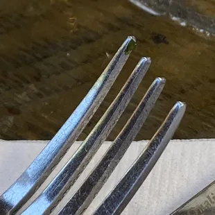 Dirty fork with cilantro.