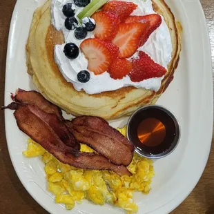 Max&apos;s pancakes- strawberry, kiwi, blueberries, whipped cream, eggs bacon