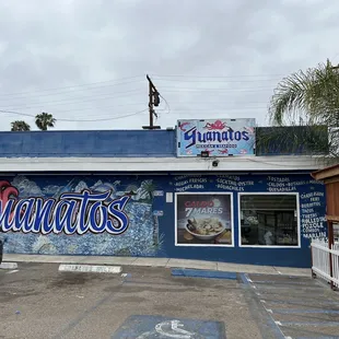 a car parked in front of a restaurant