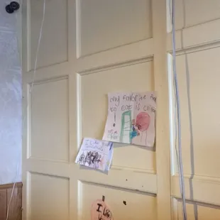 a wall with notes on it