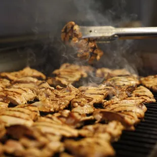a person cooking on a grill
