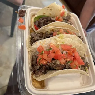 Asada tacos in special holder