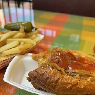 Table and my delicious hotdog and fries.