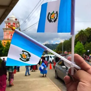 a person holding a guatemalan flag