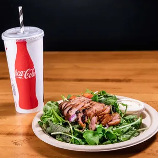 Smoked Chicken Salad, with Kahumana Mixed Greens, Grape Tomatoes, Dried Cranberries, Sunflower Seeds, and our house Creamy Vinaigrette.