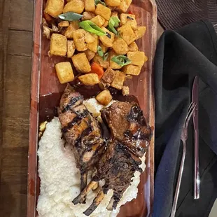 Lamb chops on grits and potatoes