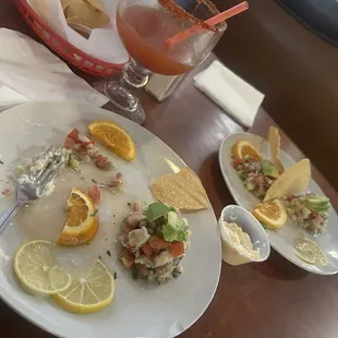 Fish ceviche tostada and shrimp ceviche tostada with michelada