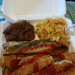 Fish dinner with Mac n cheese and yams.