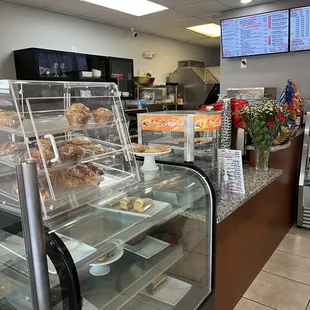 a counter with a variety of baked goods