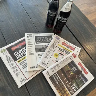 Daily Racing Form and cold Mexican Coca Colas
