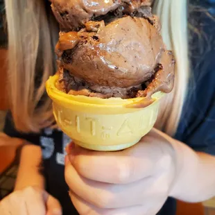 Chocolate Fudge Brownie ice cream. The cone says &quot;Eat it All.&quot; She did.