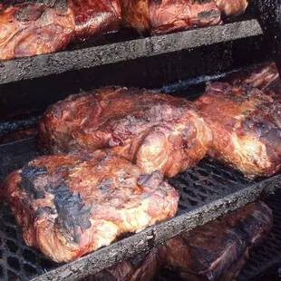 the meat being cooked on the grill