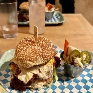 Mexican street burger with fried egg, smash patty, avocado, American cheese, ham and lettuce on sesame bun - absolutely delicious!!!