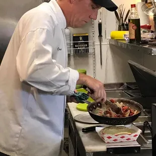 a chef preparing food in a kitchen