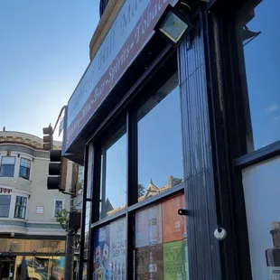 the reflection of the building across the street