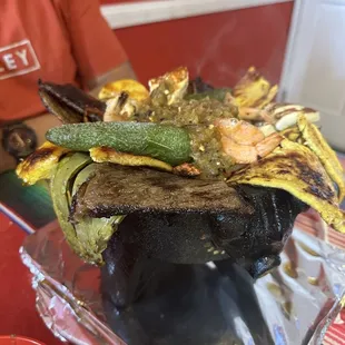 a grilled steak with vegetables
