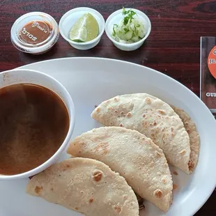 Birria de Chivo tacos with consome