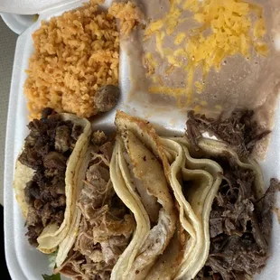 Fajita, Carnita, Fish and Barbacoa Tacos with rice and beans.