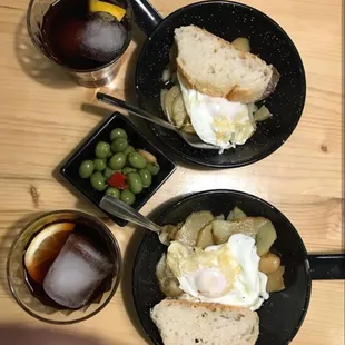 two plates of food and a glass of wine