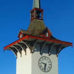 a clock tower with a steeple