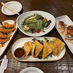 Bang bang shrimp, avocado salad, and crab rangoons, spicy jumbo crab roll.