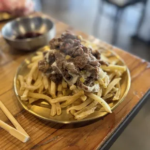 Bulgogi on fries and cheese corn